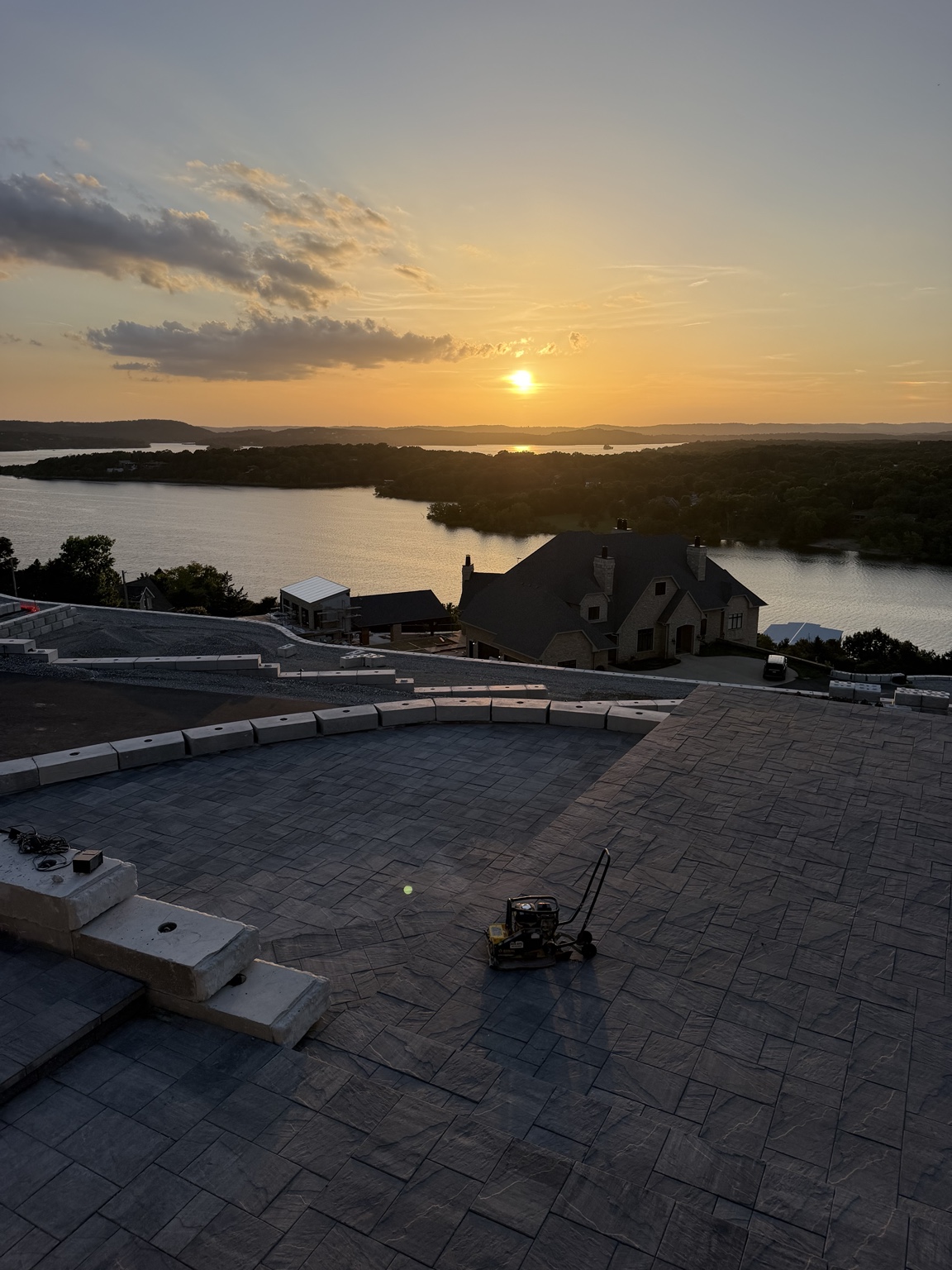 Paver patio overlooking the lake at sunset